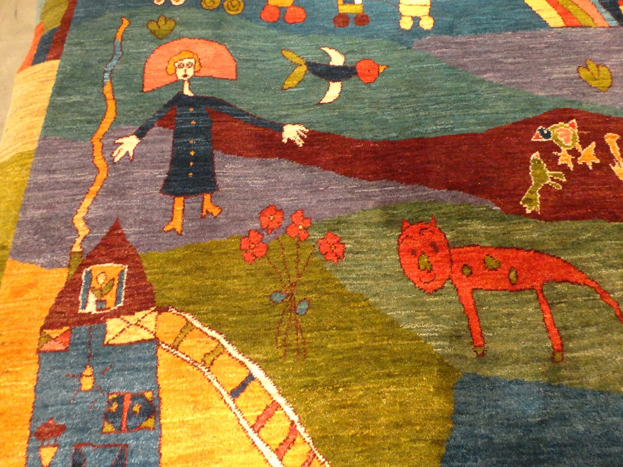 メルヘンで絵本のような絵柄のアートギャッベ絨毯